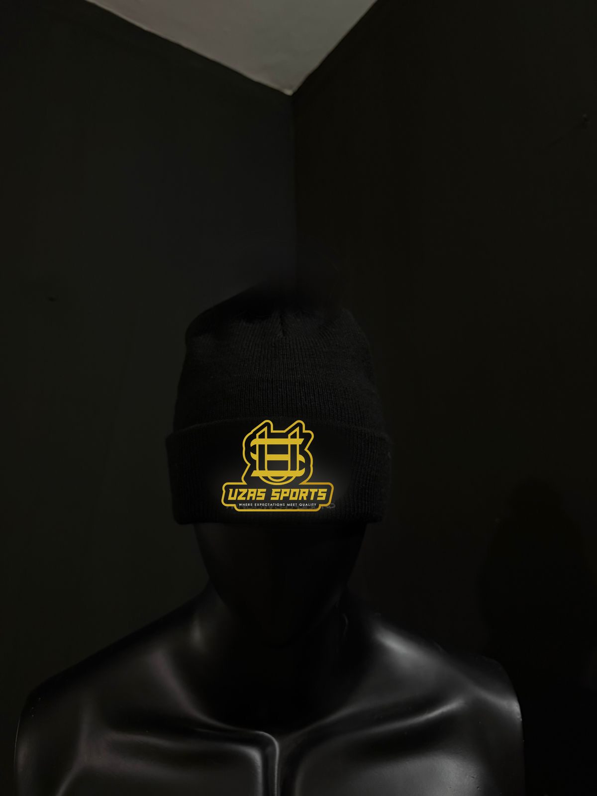 Black beanie with an embroidered logo (customer logo replaced)