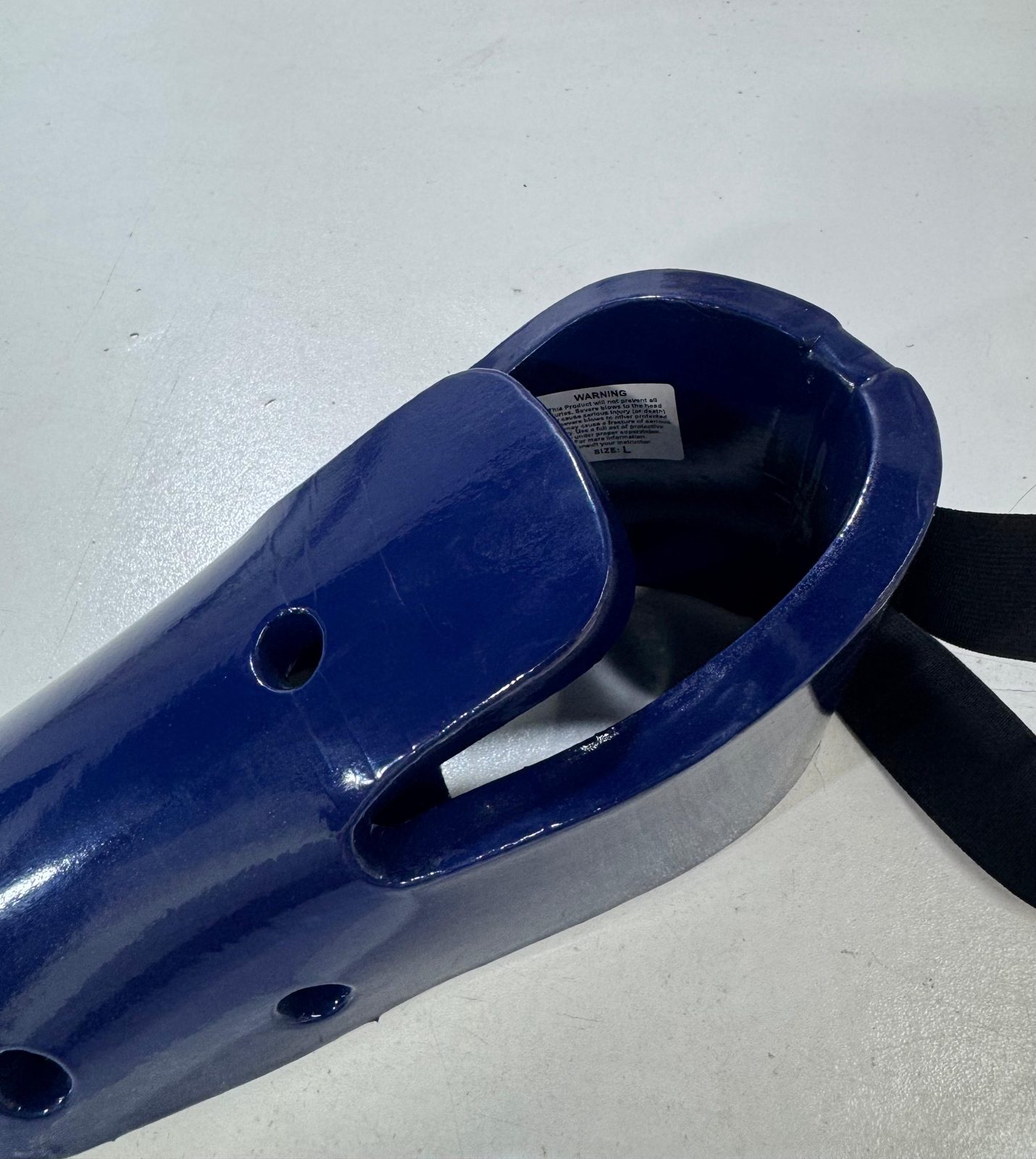 Close-up of a blue taekwondo foot protector