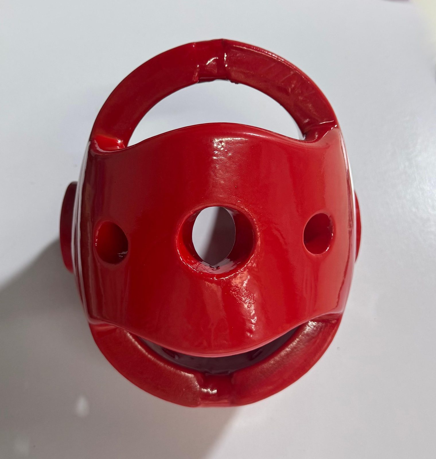 Red taekwondo head guard seen from above